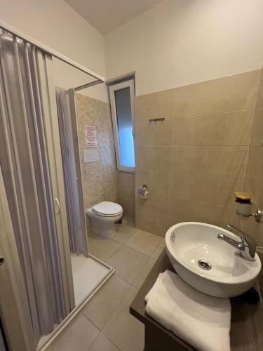 a bathroom with a sink and a toilet and a shower at B&B La Dolce Vita in Campomarino