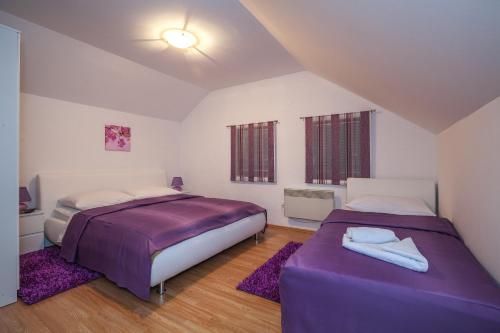 Posteľ alebo postele v izbe v ubytovaní Guest House Slavica