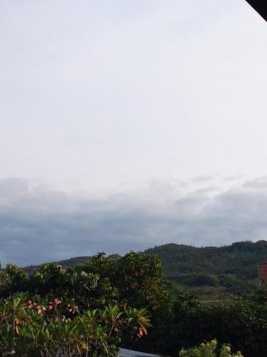 a view of the hills and trees in the distance at Hostal Villa Laurita in Riofrío