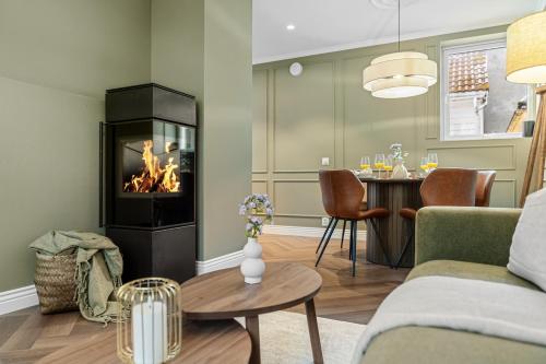 a living room with a couch and a fireplace at The Townhouse Dream I No Expense Spared I NEW 2025 in Bergen