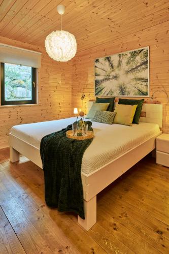 a bedroom with a large bed in a room at Eifelzeit in Rieden