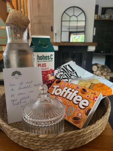 a basket with a bottle of iodine and a sign at Emerald Chalet in Praid