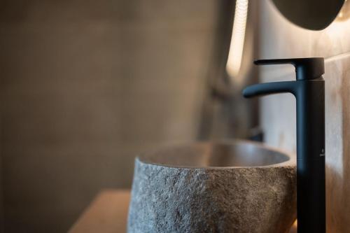 a metal container with aaucet on top of a sink at Love room Aubagne in Aubagne