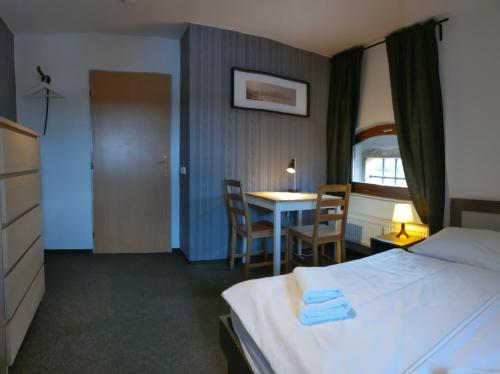 Ein Bett oder Betten in einem Zimmer der Unterkunft Hotel Antoň