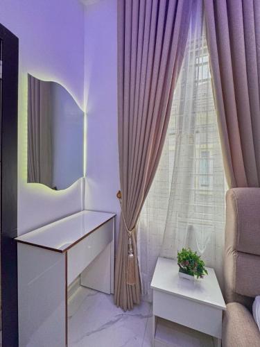 a living room with a table and a window at luxury 3bed rooms duplex lekki Lagos nigeria in Lekki