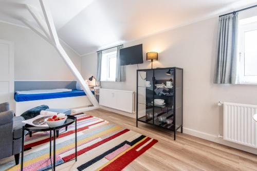 Apartamento con sala de estar con escalera. en Steger-Hüs Wohnung 33, en Rantum