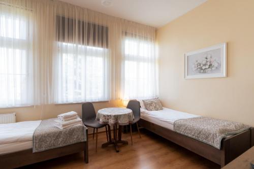Llit o llits en una habitació de Willa Dusia