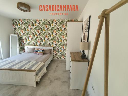 a bedroom with a bed and a wall at Casa di Campara Villa in Neum