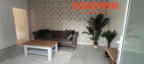 a living room with a couch and a table at Casa di Campara Villa in Neum