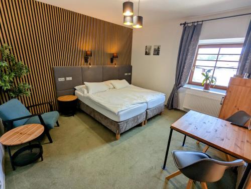 Ein Bett oder Betten in einem Zimmer der Unterkunft Hotel Antoň