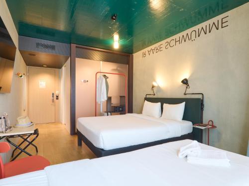 Postel nebo postele na pokoji v ubytování ibis Styles Bern City