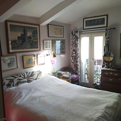 a bedroom with a large bed and a window at 2 Rue de la Tour in Aniane