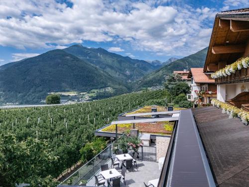 a balcony of a house with a view of mountains at Tirolerhof Pension in Naz-Sciaves
