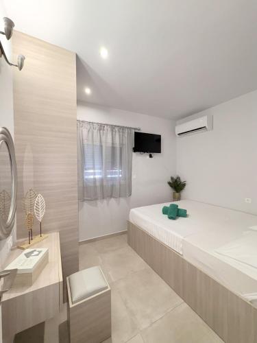 Ένα ή περισσότερα κρεβάτια σε δωμάτιο στο M&N Apartments