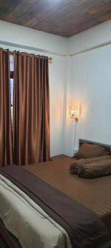 Ένα ή περισσότερα κρεβάτια σε δωμάτιο στο KL villa