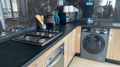Η κουζίνα ή μικρή κουζίνα στο Appartement Moderne Vert