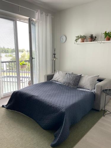 Ένα ή περισσότερα κρεβάτια σε δωμάτιο στο Stylish downtown studio apartment