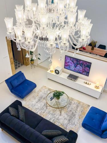 an overhead view of a living room with a chandelier at Kaple Jinak in Vrchovany