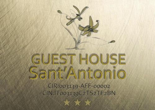 a guest house san animino sign with a flower at Guest House Sant'Antonio 
