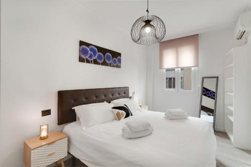 Ένα ή περισσότερα κρεβάτια σε δωμάτιο στο Escape and Elevate Las Palmas