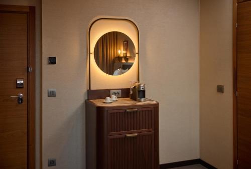 a bathroom with a sink and a mirror at Hilton Milan in Milan