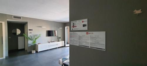 a living room with a poster on the wall at CRI'S & YOU guest room in Cosenza