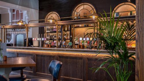 a bar with a lot of bottles of alcohol at Toll House Inn in Lancaster