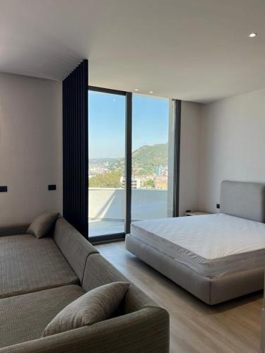 Ένα ή περισσότερα κρεβάτια σε δωμάτιο στο Emera Apartments