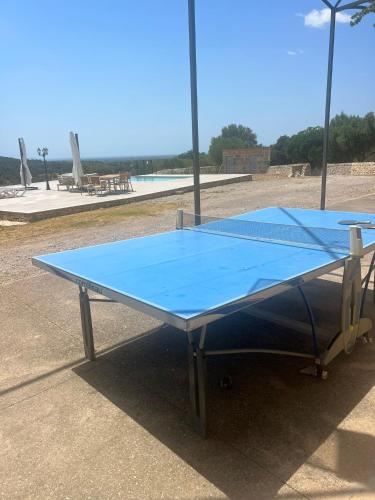 a blue ping pong table sitting in a parking lot at Villa Son Pons by Slow Villas in Llucmajor