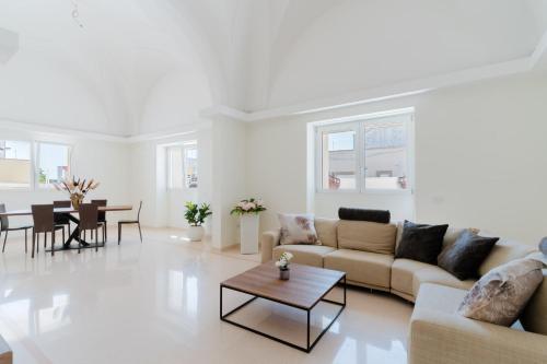 a living room with a couch and a table at Ca' Rosa - Salento Selection in Acquarica del Capo