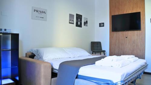 Ένα ή περισσότερα κρεβάτια σε δωμάτιο στο Teodorico 21 Center & Comfort