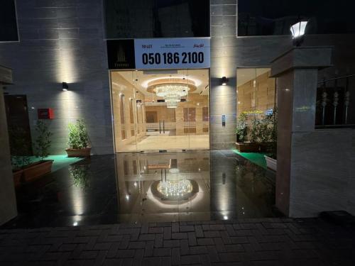 a lobby of a building with a sign on it at JSCOM Grand Residence ABU HAIL in Dubai