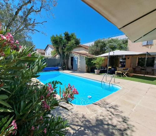 a swimming pool in the backyard of a house at Chez J-JM in Marseille