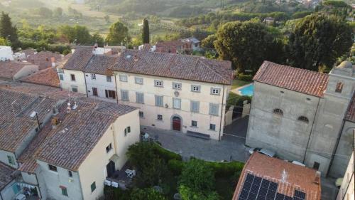 an aerial view of a village with buildings at Palazzo Fioretti Tuscany in Terricciola