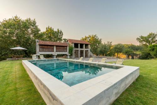 a swimming pool in the yard of a house at Stars View by Portugal Active in Fafe