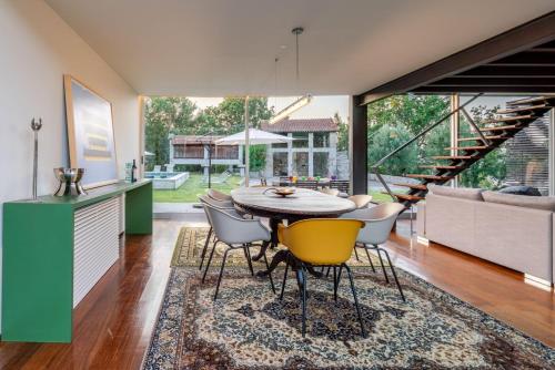 a kitchen and dining room with a table and chairs at Stars View by Portugal Active in Fafe