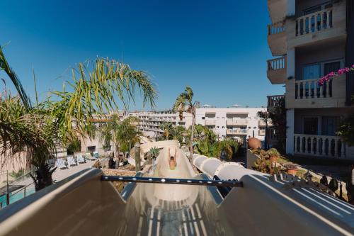 a view of a water slide at a resort at Hotel Alba Seleqtta in Lloret de Mar