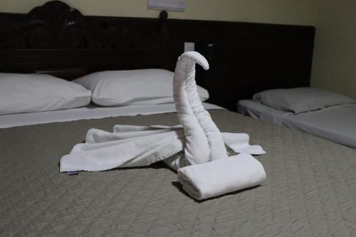 Postel nebo postele na pokoji v ubytování Hotel Casa Encantada