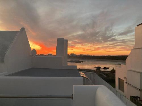 a view of a sunset from the balcony of a building at Serendipity 'where luck meets intent' in Jacobs Bay