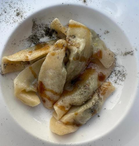 a white plate of food with chicken wings on it at Bes Hotel Terme a Palazzago in Palazzago