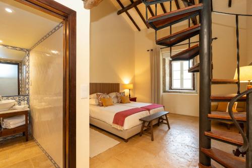 Ένα ή περισσότερα κρεβάτια σε δωμάτιο στο The Manor House Celeirós