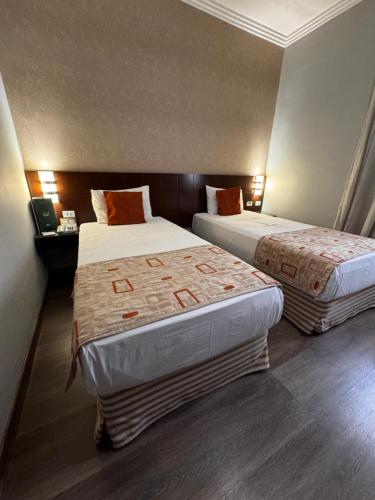 Postel nebo postele na pokoji v ubytování Class Hotel Guaxupé