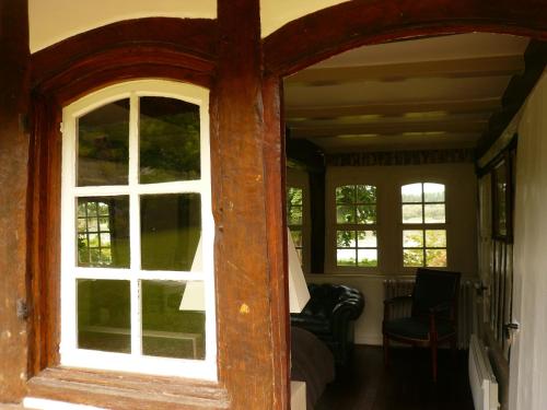 an open door to a room with a window at La Bonne Auberge - Seine Panorama SAS in Vieux-Port