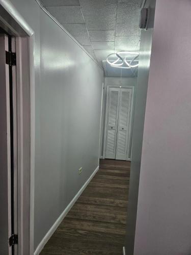a hallway with white walls and a ceiling at Super Comfy Entire Home in Scranton