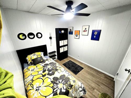 a bedroom with a bed and a ceiling fan at Super Comfy Entire Home in Scranton