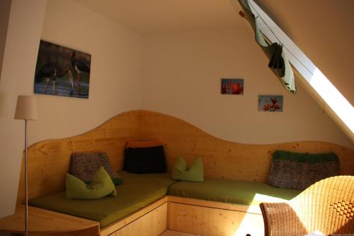 a room with a bed under the stairs at BIO-Hotel Kenners LandLust in Göhrde