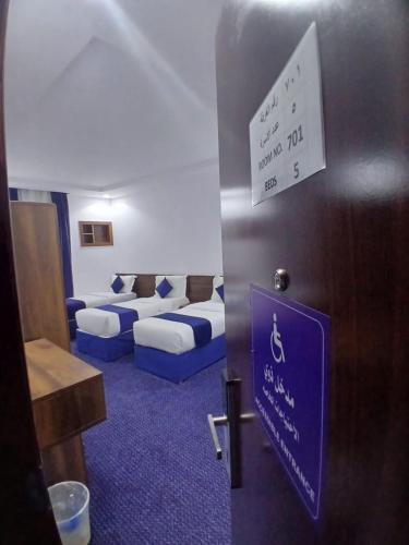 Postel nebo postele na pokoji v ubytování فندق منارة البيت