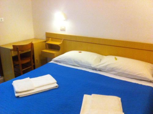 Postelja oz. postelje v sobi nastanitve Hotel Italia