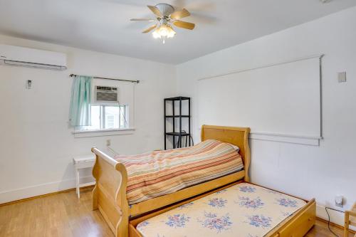 a bedroom with a bed and a ceiling fan at 3 Mi to Beaches Low-Key San Pedro Rental! in San Pedro