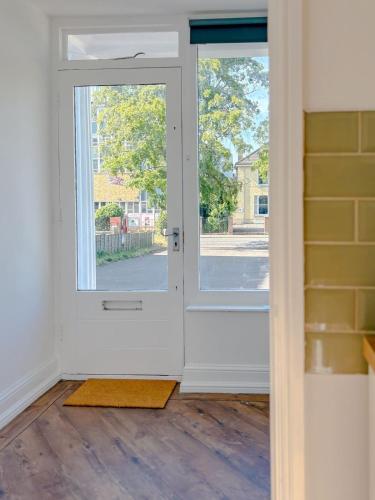 an open door with a view of a street at 58 Thorpe road - City Centre in Norwich